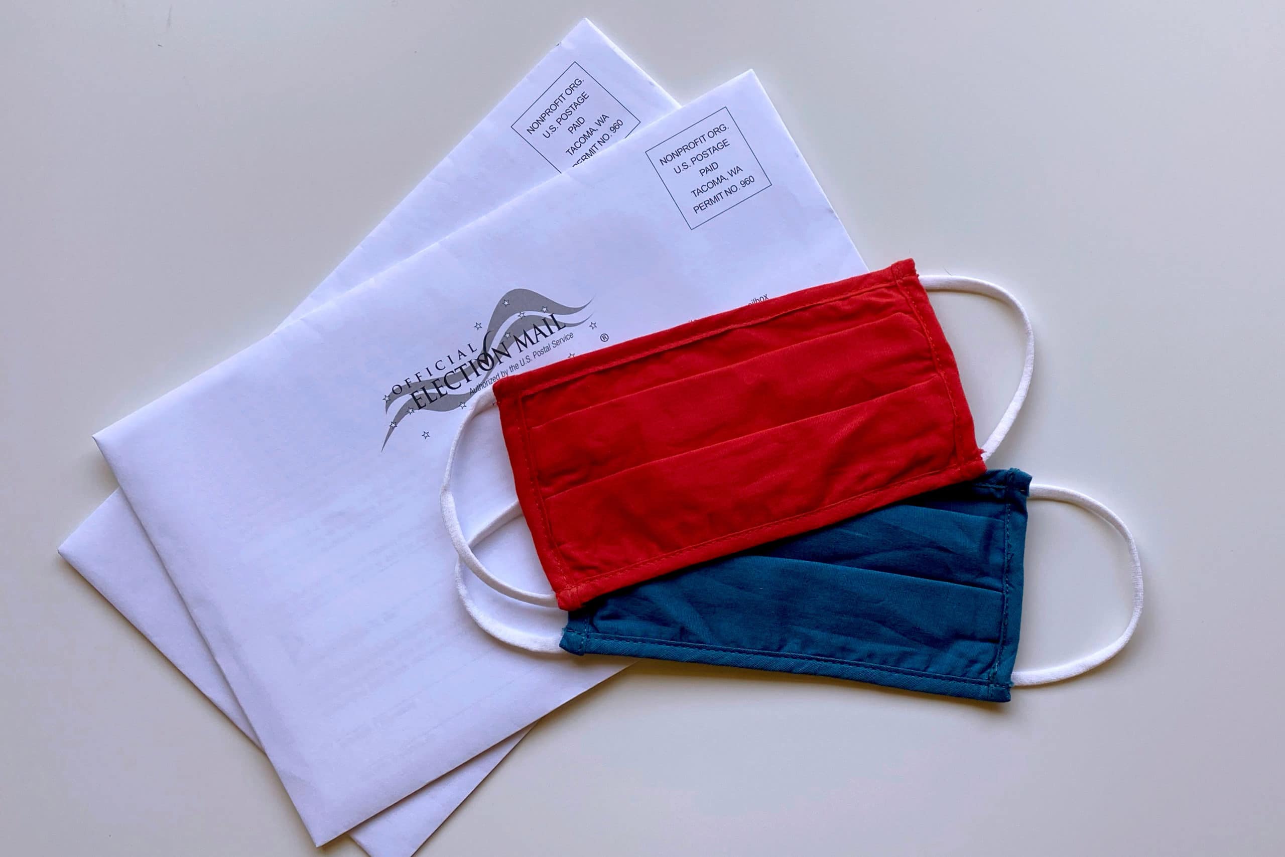 tiffany-tertipes-eZN29rv_TcE-unsplash_cropped Photo of facemasks, vote-by-mail envelopes