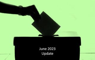 Hand drops ballot into box – June 2023 update