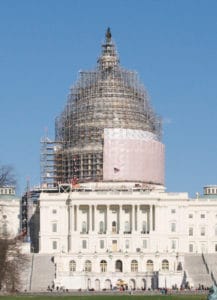 Photo of US Capitol with scaffolding illustrating government as a work in progress