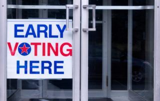 Early voting sign on a door
