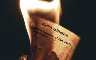 Image of a ballot initiative being burned